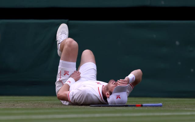 Andy Murray looked in pain after slipping over in the fourth set