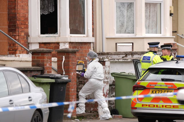 Forensics officers at a house in Wellingborough