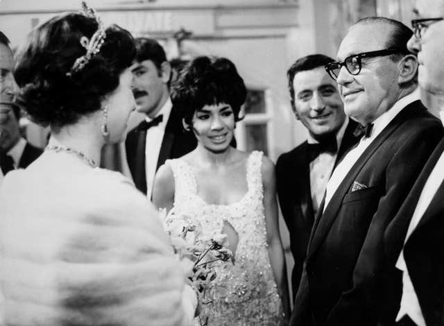 The then Queen talking with Americans Jack Benny and Tony Bennett and Britain’s Shirley Bassey (PA)