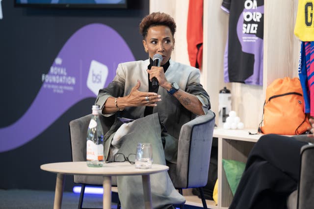 Dame Kelly Holmes speaking while seated on a panel