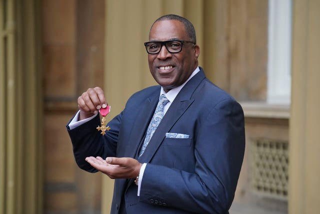 Bishop Derek Webley at investiture at Buckingham Palace