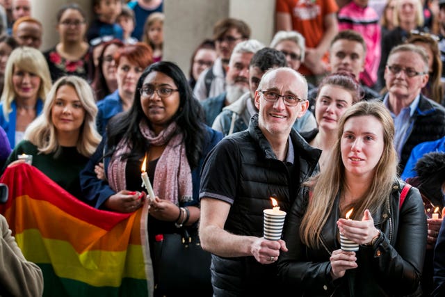 People holding candles at the vigil