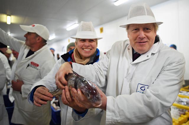 Prime Minister Boris Johnson during a visit to Grimsby Fish Market 