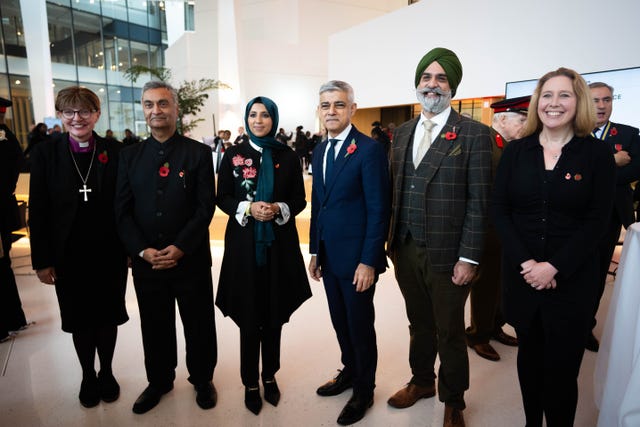 People standing in a line at London's City Hall