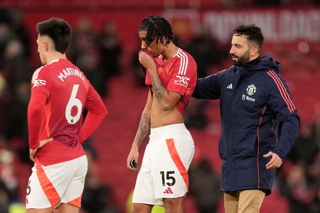 Manchester United manager Ruben Amorim, Leny Yoro and Lisandro Martinez stand dejected after defeat by Bournemouth