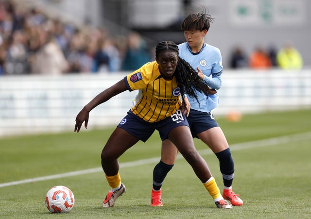 Michelle Agyemang, left, on the ball for Brighton under pressure from Manchester City’s Aoba Fujino