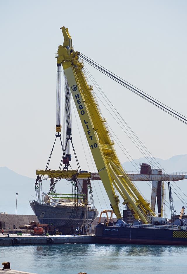 A crane lifts tech tycoon Mike Lynch’s superyacht the Bayesian