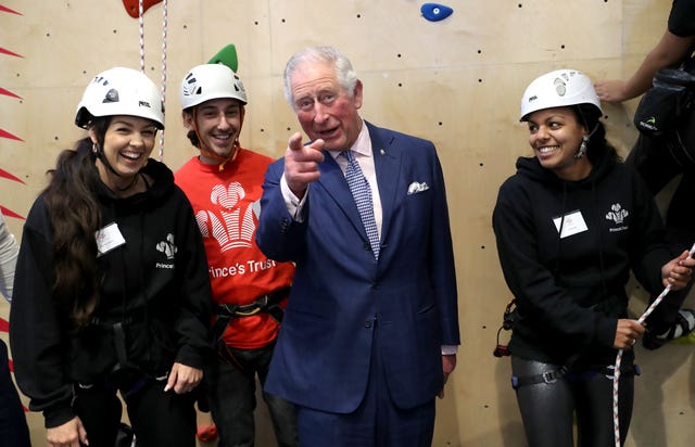 The Prince of Wales meets young people at the climbing wall