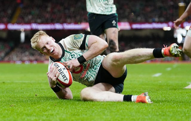 A sliding Jamie Osborne scores a try for Ireland