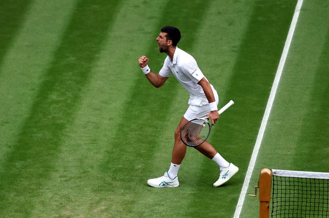 Novak Djokovic clenches his fist after winning the third set