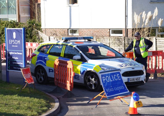 Police outside Epsom College in Surrey after the trio's deaths