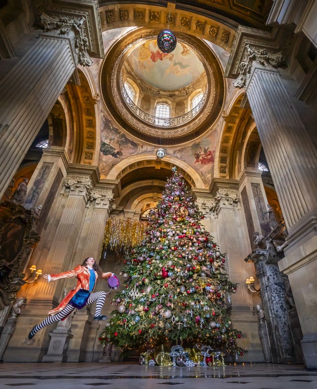 Poppy Avison-Fell dressed as the Mad Hatter at the unveiling of a 27ft Christmas tree in Castle Howard’s Great Hall in North Yorkshire