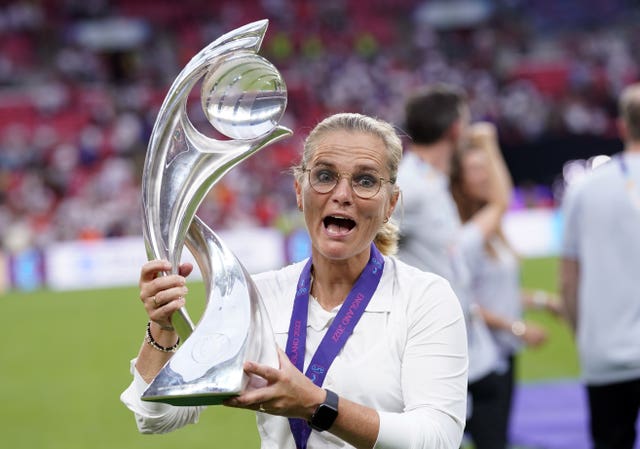 England boss Sarina Wiegman celebrates with the trophy after her side's victory in the Euro 2022 final (Danny Lawson/PA).