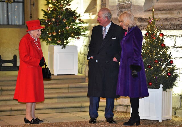 The Queen with the Prince of Wales and the Duchess of Cornwall in the quadrangle at Windsor Castle