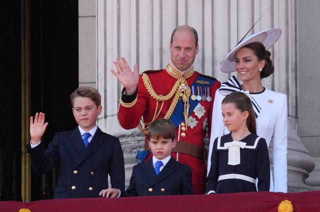 The Prince and Princess of Wales with their children, Prince George, Prince Louis, and Princess Charlotte on the balcony of Buckingham Palace in June