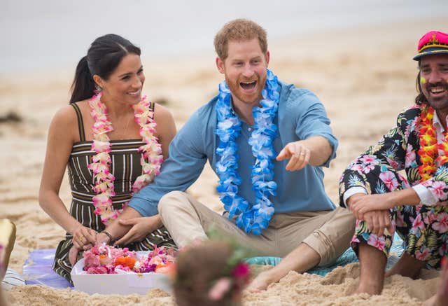 The Duke and Duchess of Sussex meet members of surfing community group One Wave during a visit to South Bondi Beach in Sydney in 2018 