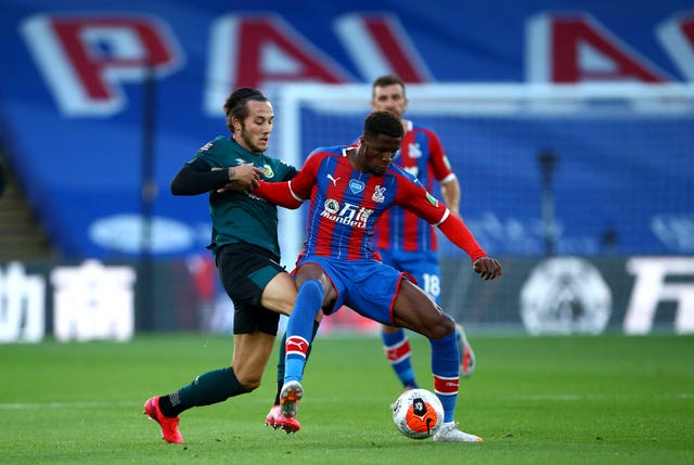Josh Brownhill, left, and Crystal Palace’s Wilfried Zaha battle for the ball 