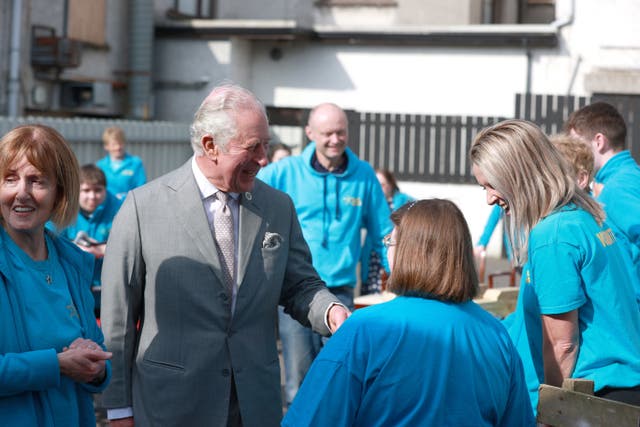 The Prince of Wales meets volunteers at the Superstars cafe in Cookstown