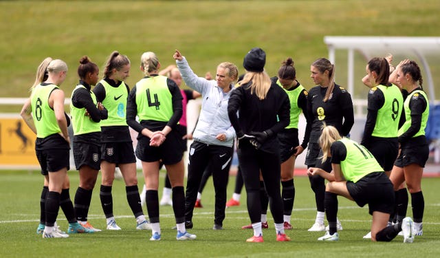 England boss Sarina Wiegman with her players at St George's Park (Bradley Collyer/PA).