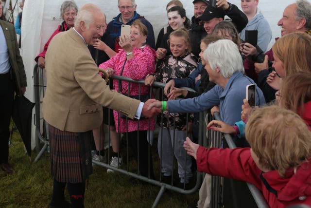 Charles shaking hands with attendees at the Mey Highland Games