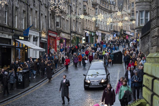 People line the streets as Janey Godley’s hearse travels through Edinburgh 