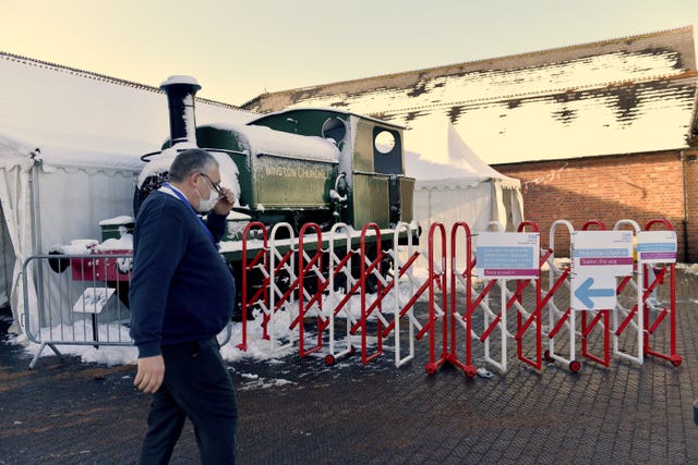 Signs directing users to the vaccination clinic in front of a vintage train at the entrance to The Black Country Living Museum in Dudley (Jacob King/PA)