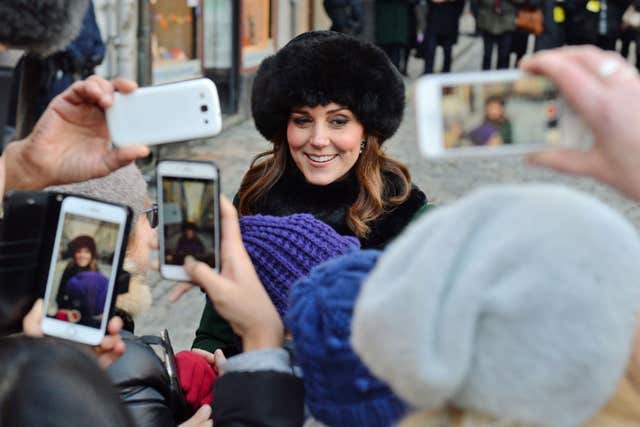 Smartphones were out in force as Kate walked from the Royal Palace of Stockholm to the Nobel Museum (Dominic Lipinski/PA)