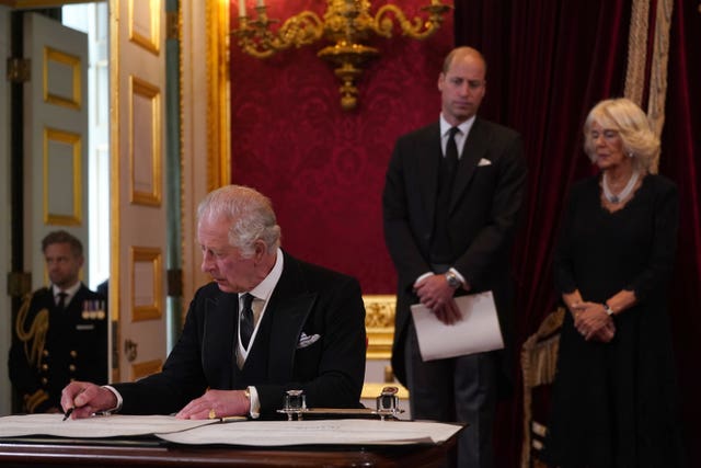 King Charles III signs an oath to uphold the security of the Church in Scotland during the Accession Council at St James’s Palace, London 