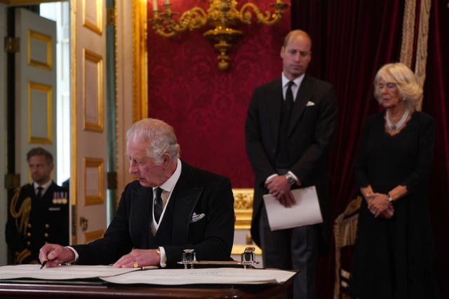 King Charles III signs an oath to uphold the security of the Church in Scotland during the Accession Council at St James’s Palace, London 