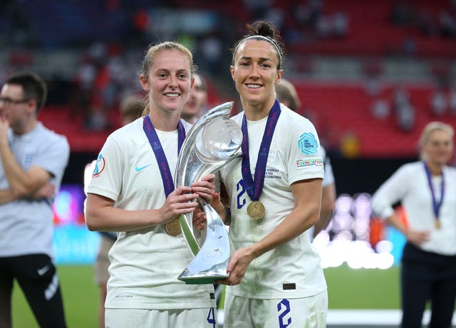 Bronze and Walsh (left) with the trophy after England won the Euros last summer (Nigel French/PA)