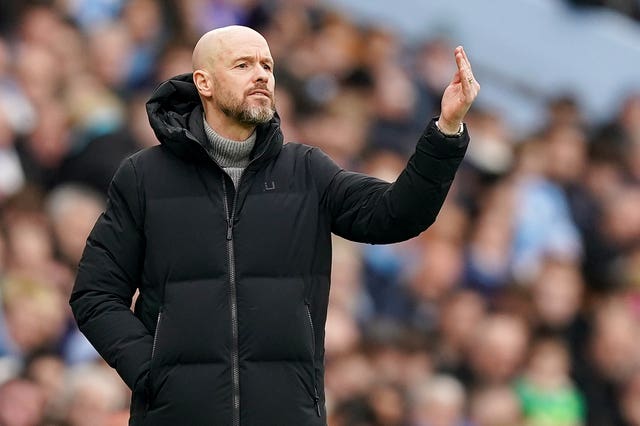 Erik ten Hag gestures on the touchline during a game