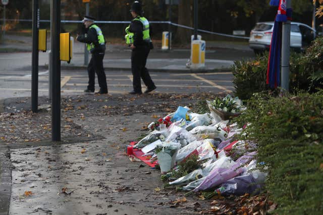 Flowers left at the scene after the tram crash in Croydon, Surrey (Steve Parsons/PA)