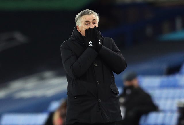 Everton manager Carlo Ancelotti covers his face with his hands