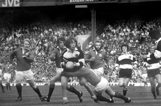 Lions wing Peter Squires tackles the Barbarians' JPR Williams in the 1977 Silver Jubilee match at Twickenham