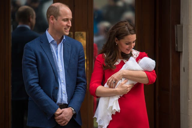 The young prince with his proud parents (Dominic Lipinski/PA)