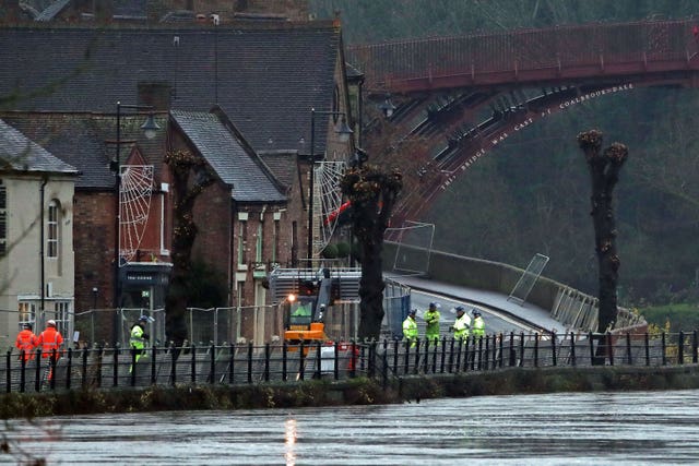 Flood bariries being erected on the River Severn, near Ironbridge, Shropshire (Nick Potts/PA)