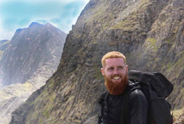 Russ Cook with mountainous backdrop