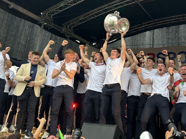 Mayo Gaelic football players celebrate with the Sam Maguire trophy during a homecoming celebration at MacHale Park stadium in Castlebar