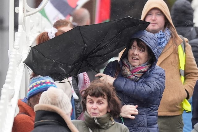 A person struggles with their umbrella as the wind picks up in Dublin’s city centre