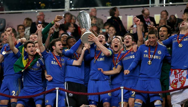 Chelsea players celebrate with the Europa League trophy 