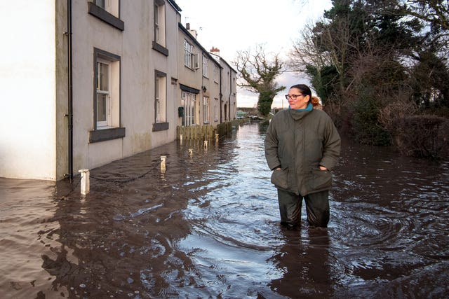 Gabrielle Burns-Smith outside her flooded home (Joe Giddens/PA)  
