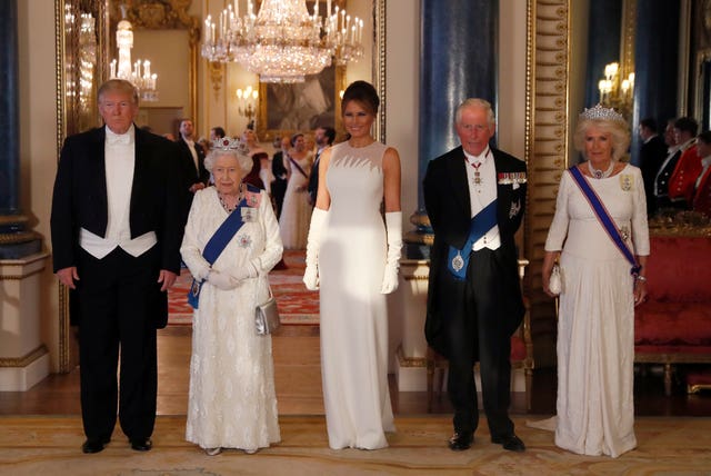 Trump, Queen Elizabeth II, Melania Trump, the Prince of Wales and the Duchess of Cornwall, during a group photo ahead of the State Banquet at Buckingham Palace, London, on day one of US President Donald Trump’s three day state visit to the UK