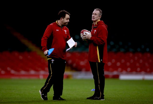 Rob Howley talks with Matt Sherratt, left, during a training session