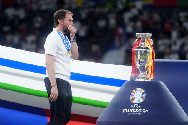 England boss Gareth Southgate walks past the Henri Delaunay Cup after his side's 2-1 defeat by Spain in the Euro 2024 final