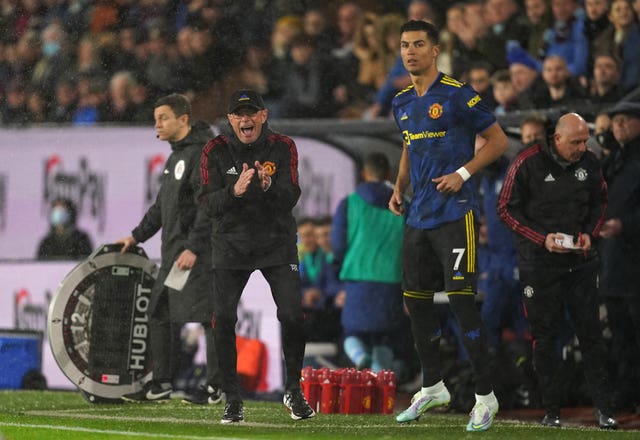 Ralf Rangnick shouts instructions to his team as substitute Cristiano Ronaldo, right, prepares to enter the game