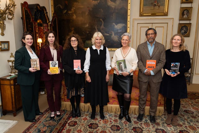 Left to right, Yael van der Wouden, Rachel Kushner, Anne Michaels, Queen Camilla, Charlotte Wood, Percival Everett and Samantha Harvey during a reception for the Booker Prize Foundation at Clarence House, London