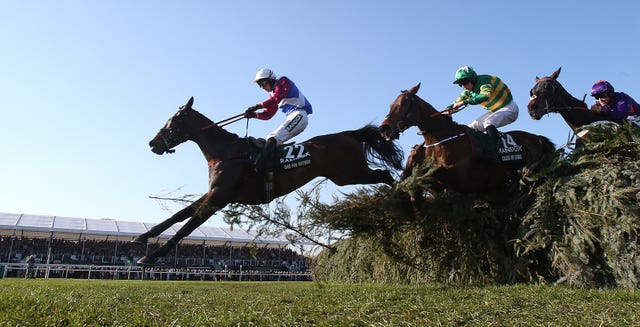 One For Arthur and Derek Fox jump the last in the 2017 Grand National 