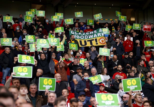 Manchester United fans hold up anti-Glazer placards ahead of the club's final home game of the season. Around 10,000 supporters attended the 1-1 draw with relegated Fulham. Despite ongoing opposition to United's owners, there was no significant demonstration prior to kick-off