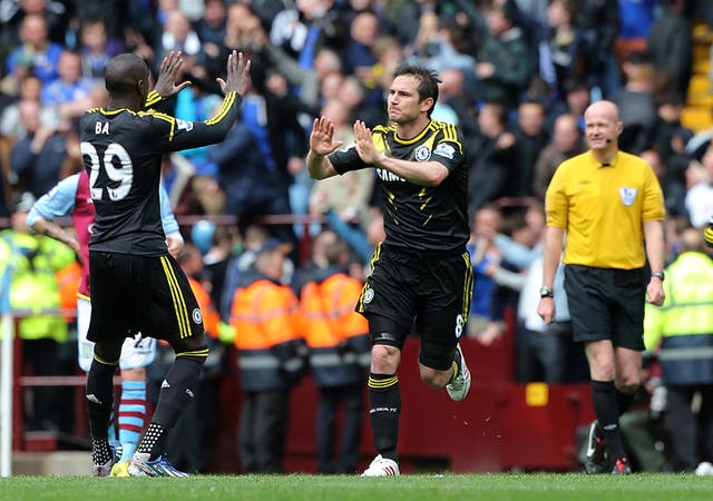 Frank Lampard, right, celebrates becoming Chelsea's record scorer in 2013
