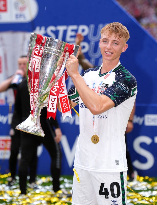 Sunderland goalscorer Tommy Watson lifts the trophy following victory over Sheffield United in the Sky Bet Championship play-off final at Wembley